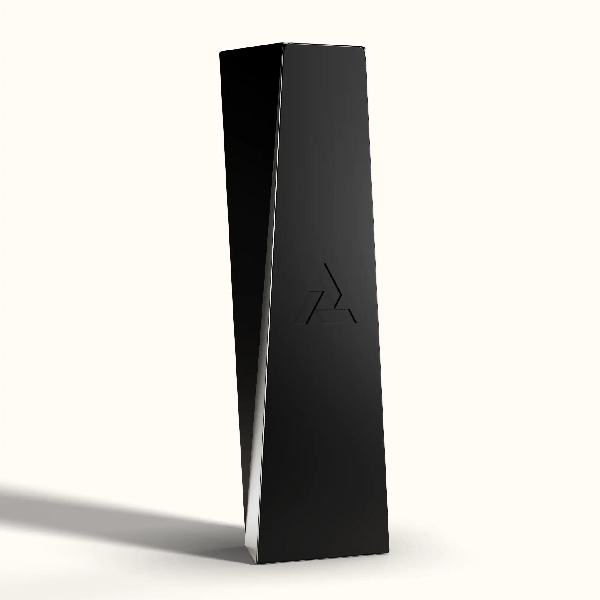 Tempest black magnetic piece standing upright, facing away from the camera and showing the logo on its back, on a neutral studio background