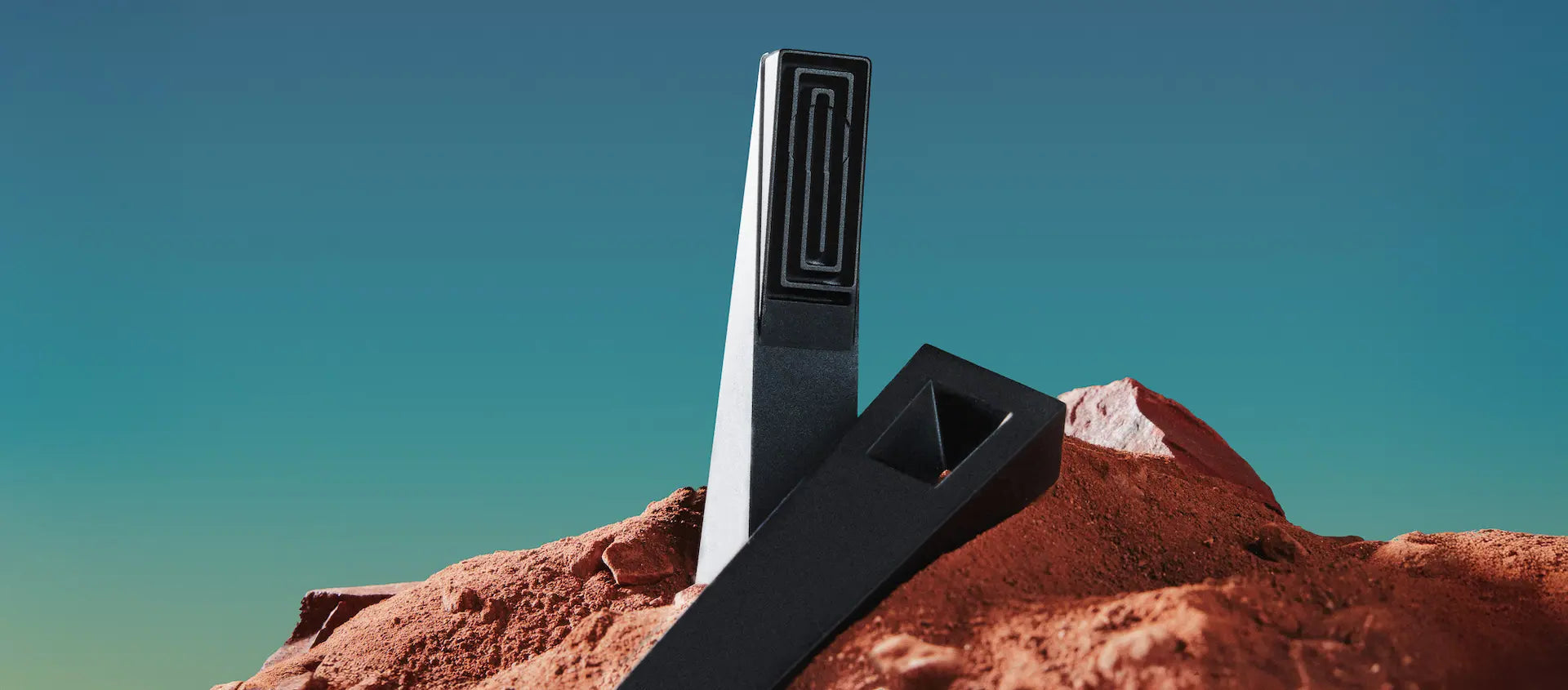 Black and silver Tempest device on a rocky outcrop with a clear blue sky
