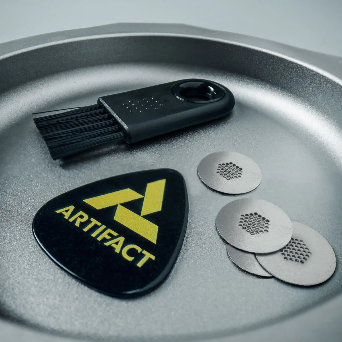 Tempest Field Kit: cleaning brush, pick tool, and four titanium inserts in a metal Vesta catchall container