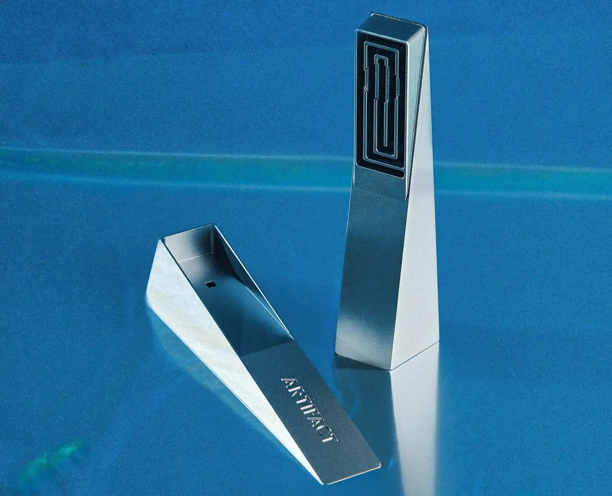 Tempest modern piece opened showing its internal pathway and 'Artifact' branding on a blue background