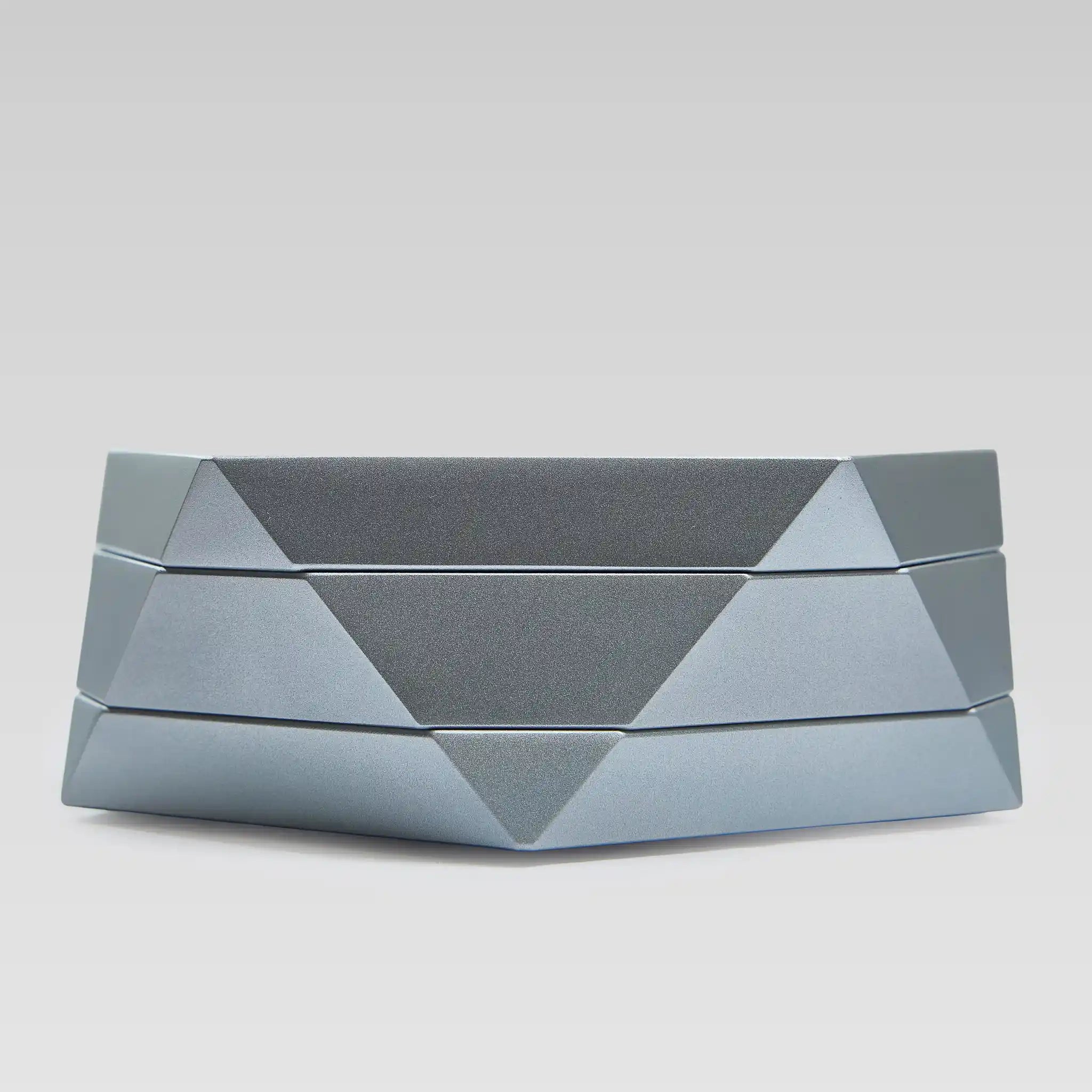 Vesta silver magnetic vessel open, low angle showing the faceted geometric body